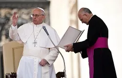 Msgr. Alfred Xuereb, newly appointed prelate secretary general of the Secretariat for the Economy, assists Pope Francis at a General Audience, April 17, 2013. ?w=200&h=150