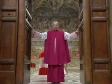  Monsignor Guido Marini closes the Sistine Chapel door as the Conclave begins on March 12, 2013. 
