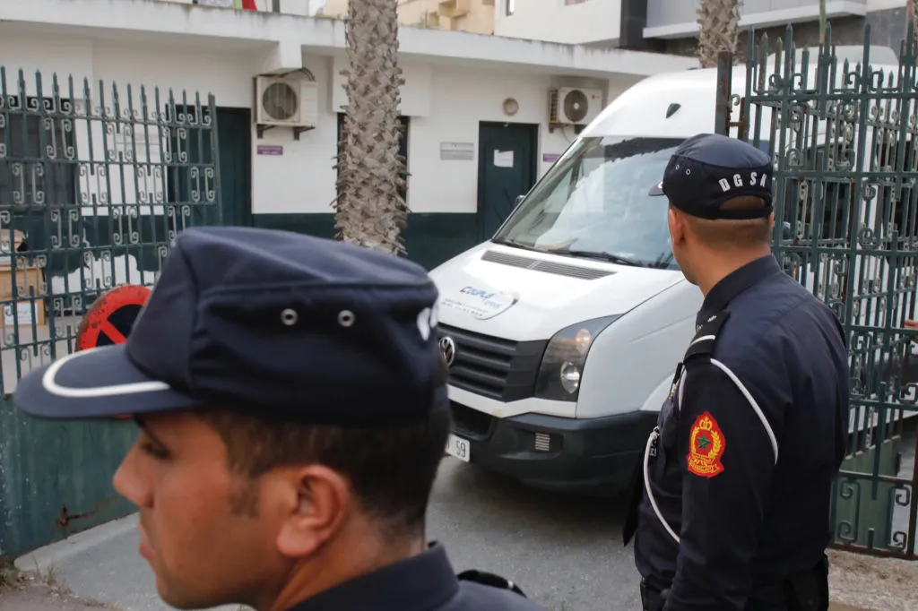 Moroccan security forces stand guard as a van leaves the court following Hajar Raissouni's sentencing for procuring an abortion in the capital Rabat, Sept. 30, 2019. ?w=200&h=150