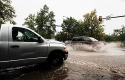 Motorists attempt to drive through downtown Boulder after three days of heavy rainfall Sept. 12, 2013 in Boulder, CO. ?w=200&h=150