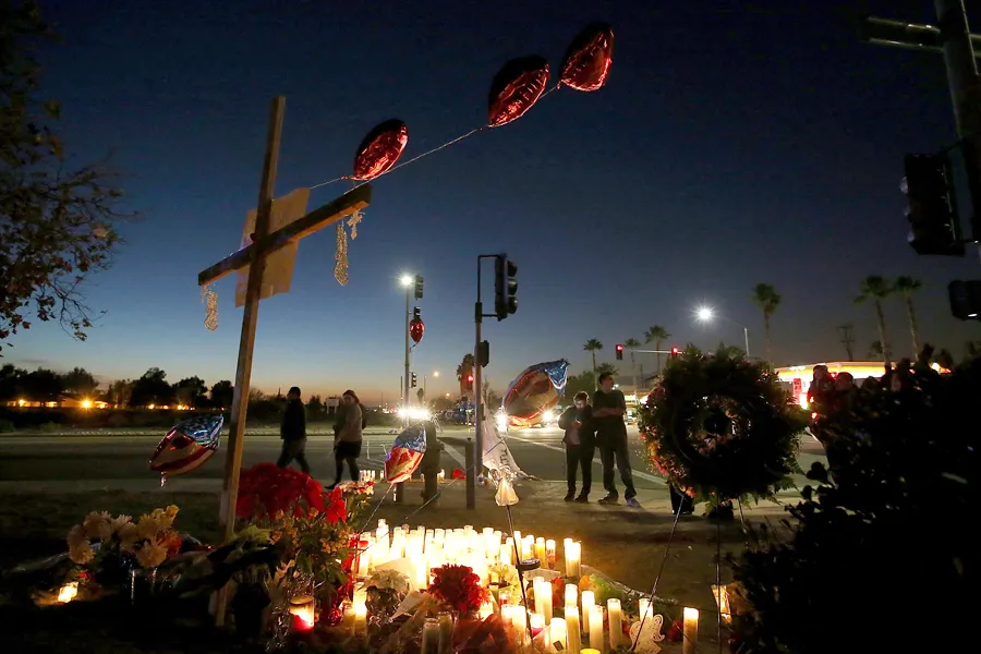 Mourners gather at a makeshift memorial near the Inland Regional Center, Dec. 4, 2015 in San Bernardino, California. ?w=200&h=150