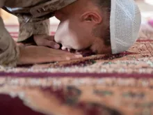 A Muslim chaplain prays during the month of Ramadan. 
