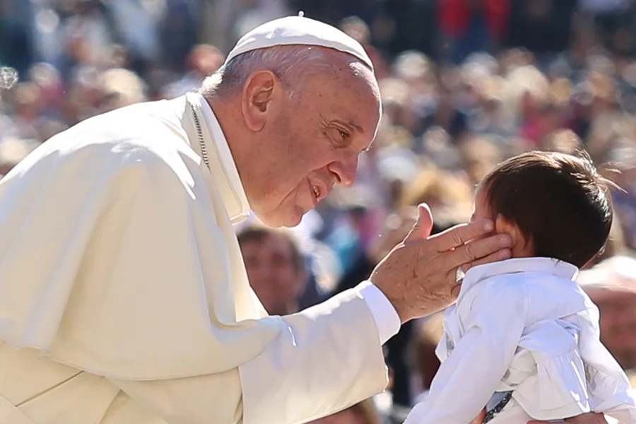 Pope Francis kisses a child in St. Peter's Square during the General Audience on April 20, 2016. Daniel Ibanez/CNA?w=200&h=150