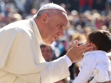Pope Francis greets a child in St. Peter's Square during the general audience on April 20, 2016. Daniel Ibanez/CNA