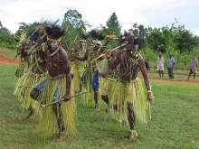 Indigenous Papuans performing a traditional dance. 