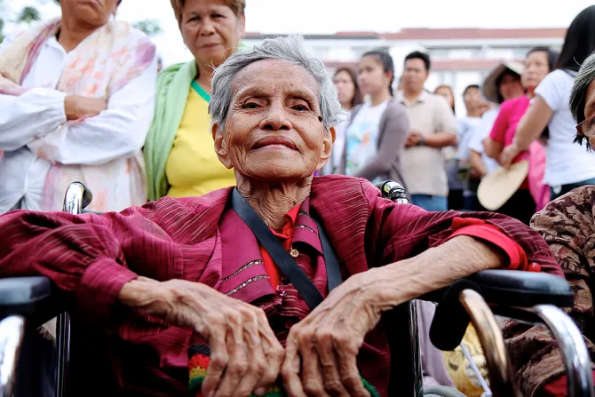 Natividad 82 waited in her wheelchair outside of Manilas Cathedral overnight to see Pope Francis on Jan 16 2015 Credit Lauren Cater CNA CNA 1 16 15