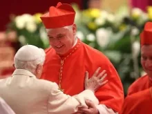 New German Cardinal, Gerhard Ludwig Muller is met by Benedict XVI in St Peter's Basilica Feb. 22, 2014. 
