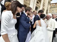 Newly married couples meet Pope Francis in St. Peter's Square on Sept. 9, 2015. 