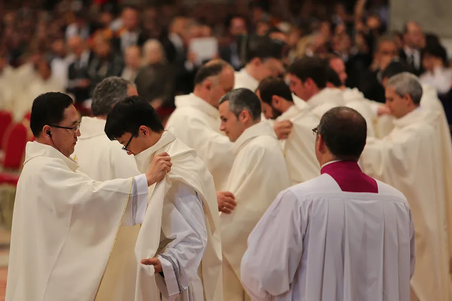 New priests are clothed with chasubles during their ordination Mass in St. Peter's Basilica, April 26, 2015. ?w=200&h=150