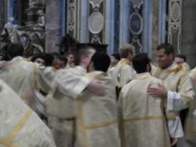 The newly ordained deacons congratulate each other after the Oct. 6, 2011 ordinations at St. Peter's Basilica