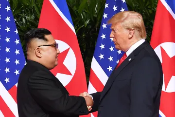 North Koreas leader Kim Jong Un L shakes hands with US President Donald Trump R at the start of their historic US North Korea summit at the Capella Hotel on Sentosa island in Singapore on June 12 2018 Credit SAUL LOEB AFP Getty Image