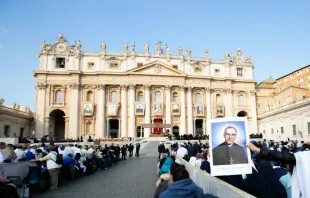 Pilgrims in St. Peter’s Square hold up an image of Saint Oscar Romero at his canonization Mass Oct. 14.   Daniel Ibáñez