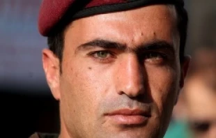 Palestinian soldier stands guard duing Pope Francis' May 25, 2014 Mass in Bethlehem's Manger Square.   Lauren Cater/CNA.