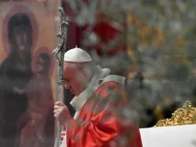 Pope Francis prays during Palm Sunday Mass April 5, 2020. 