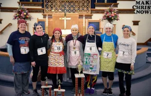 Competitors in the 2018 International Pancake Race from Liberal, Kansas, pose afterwards. Courtesy photo. 