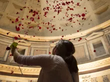 Rose petals shower from the ceiling of the Pantheon, a Pentecost tradition in Rome symbolizing the descent of the Holy Spirit. 