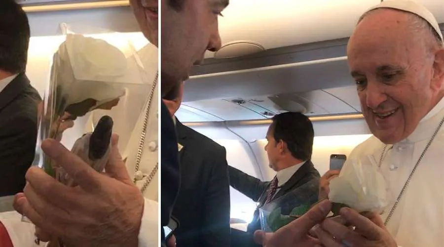 Pope Francis receives a white rose on the papal plane to Colombia on Sept. 7, 2017. ?w=200&h=150
