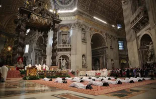 Nineteen men lie prostrate for their ordination as priests for the Diocese of Rome on April 26, 2015.   Bohumil Petrik/CNA