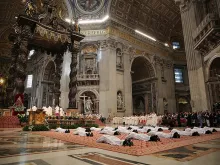 Nineteen men lie prostrate for their ordination as priests for the Diocese of Rome on April 26, 2015. 