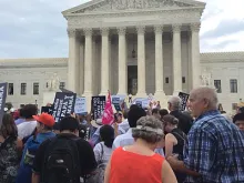 Participants in the 2014 March for Marriage stand outside the Supreme Court building in Washington, D.C., June 19, 2014. 