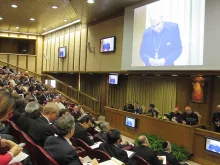 Participants listen to a presentation at the Human Colloquium in the Vatican's Synod Hall, Nov. 18, 2014. 