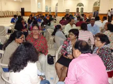 Migrant workers participate in group discussion at the We Abhor Violence Everywhere seminar in Ras al-Khaimah, UAE, Nov. 14, 2014. 