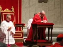 Pope Francis prays during the March 29, 2013 Passion of the Lord liturgy in St. Peter's Basilica. 