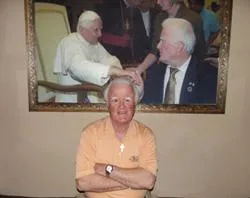 Pat Troy poses in his pub, Irelands Own, on Nov. 29  in front of a picture of himself and his wife meeting Pope Benedict.?w=200&h=150