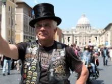 Patrick from the Corsica, France chapter of Harley-Davidson poses in front of St. Peter's Basilica on June 16, 2013. Lauren Cater/CNA.
