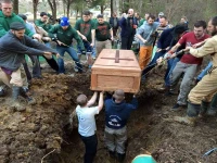 Friends lower the casket of Paul Coakley into a grave. Photo courtesy of Ann Fitzgerald.