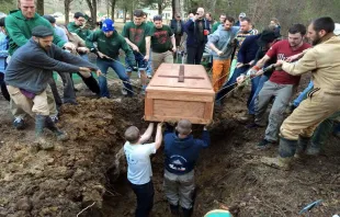 Friends lower the casket of Paul Coakley into a grave. Photo courtesy of Ann Fitzgerald. 