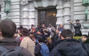 People gather outside the James R. Browning U.S. Courthouse in San Francisco, Calif.   Catholics for the Common Good