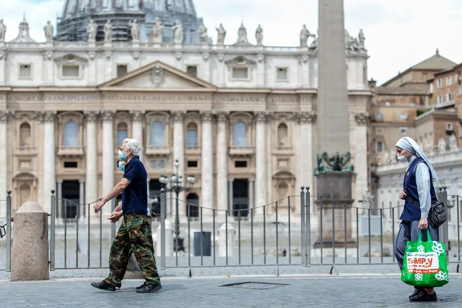 People pass in front of St. Peter's Basilica at the end of May. ?w=200&h=150