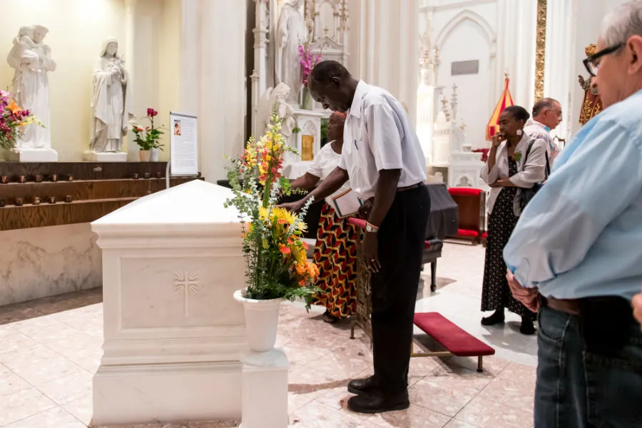 People pray before the tomb of Servant of God Julia Greeley following Mass on June 7, 2018. Photo by Anya Semenoff/Denver Catholic.?w=200&h=150