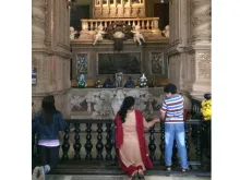 Faithful venerate the relics of St. Francis Xavier at the Basilica of Bom Jesus in Goa. 