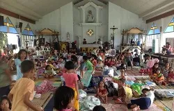 People take shelter in a parish church in the Philippines after Typhoon Haiyan swept through the area. ?w=200&h=150