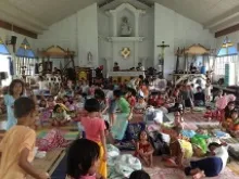 People take shelter in a parish church in the Philippines. 
