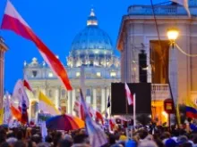 Pilgrims walk into St. Peter's Square the night before the beatification of Pope John Paul II, April 30, 2012. 