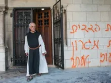 Vandals sprayed blasphemous graffiti on the walls and set fire to the door of the Abbey of Latroun. 