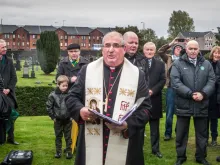 Archbishop Philip Tartaglia gives a blessing at a commemoration of the founding fathers of Celtic F.C. at St Peter’s Cemetery, Dalbeth, Glasgow, Nov. 2, 2013. Credit: PaulVIF (CC BY-SA 3.0).