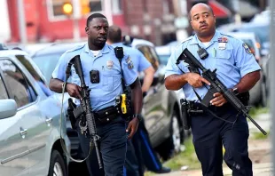 Police officers carrying assault rifles respond to a shooting on August 14, 2019 in Philadelphia, Pennsylvania.    Mark Makela/Getty Images