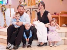 Jodi and her husband Andy with their four children