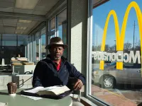 A man sits inside a McDonald's. Photo courtesy of Chris Arnade.
