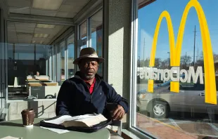A man sits inside a McDonald's. Photo courtesy of Chris Arnade. 