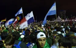 Pilgrims attended the opening Mass of the 28th World Youth Day at Copacabana Beach July 23, 2013. ?w=200&h=150