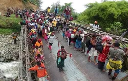 The pilgrims cross a damaged bridge near Dei, Papua New Guinea. ?w=200&h=150