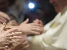 Pilgrims reaching out for Pope Francis at the Wednesday general audience in Paul VI Hall on Aug. 5, 2015. 