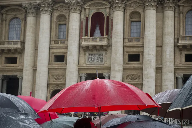 Pilgrims wait in the rain in St Peters Square March 13 2013 to see what color smoke will come out of the chimney of the Sistine Chapel Credit Jeffrey Bruno CNA CNA 3 13 13