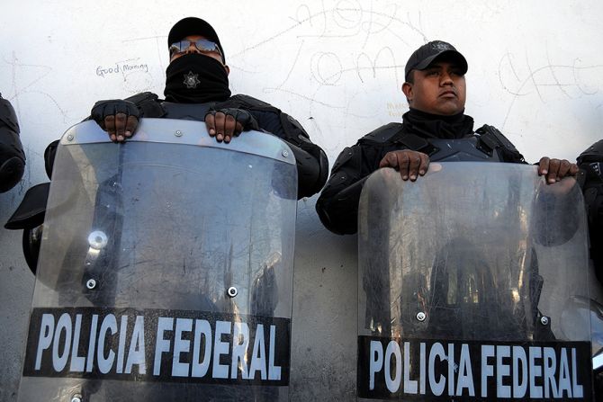 Police in riot gear in Mexico Credit Frontpage Shutterstock CNA