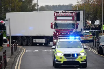 Police officers drive away a lorry in which was discovered 39 dead bodies at Waterglade Industrial Park in Grays east of London Oct 23 2019 Credit Ben Stansall AFP via Getty Images